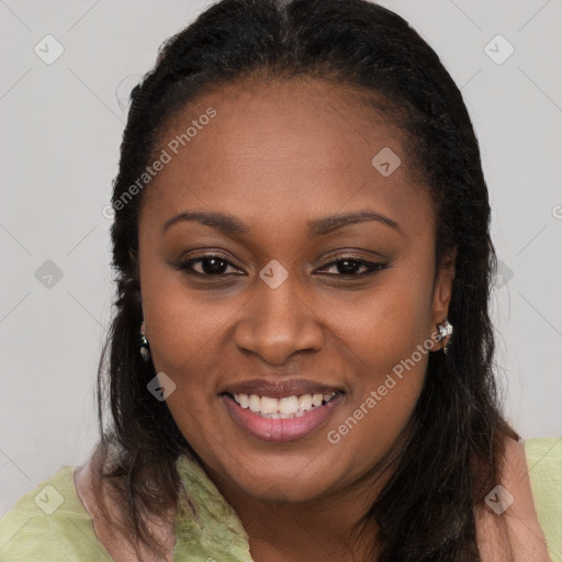 Joyful black young-adult female with long  brown hair and brown eyes