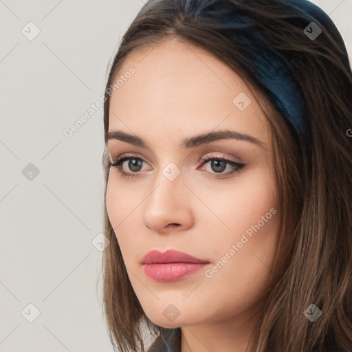 Neutral white young-adult female with long  brown hair and brown eyes