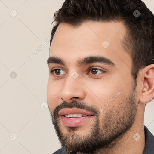 Joyful white young-adult male with short  black hair and brown eyes