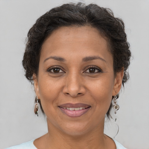 Joyful white adult female with short  brown hair and brown eyes