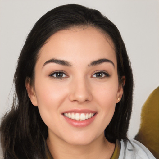 Joyful white young-adult female with long  brown hair and brown eyes