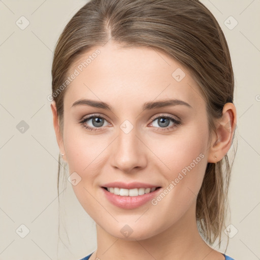 Joyful white young-adult female with medium  brown hair and blue eyes