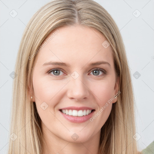 Joyful white young-adult female with long  brown hair and blue eyes