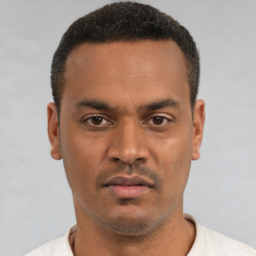 Neutral latino young-adult male with short  brown hair and brown eyes
