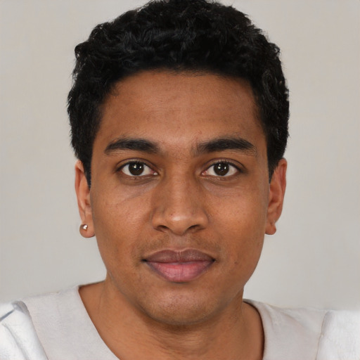 Neutral black young-adult male with short  black hair and brown eyes
