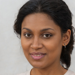 Joyful black young-adult female with medium  brown hair and brown eyes