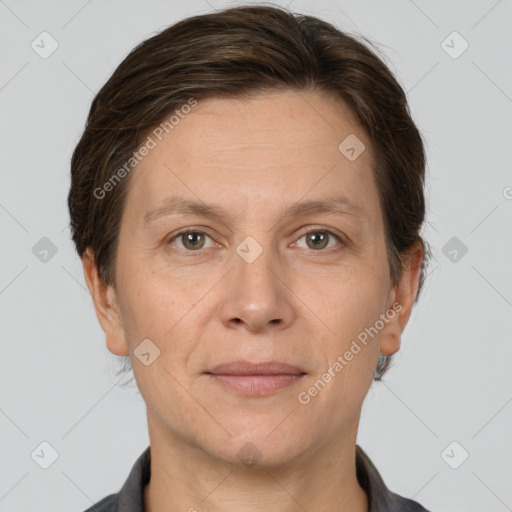 Joyful white adult female with short  brown hair and grey eyes