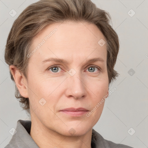 Joyful white adult female with short  brown hair and grey eyes