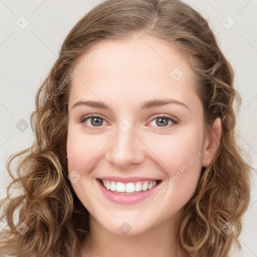 Joyful white young-adult female with long  brown hair and green eyes