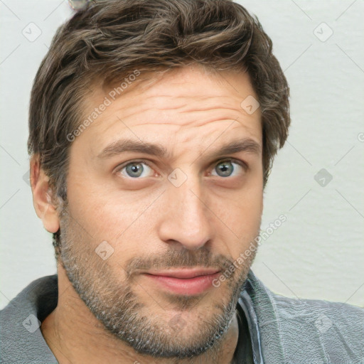 Joyful white adult male with short  brown hair and grey eyes