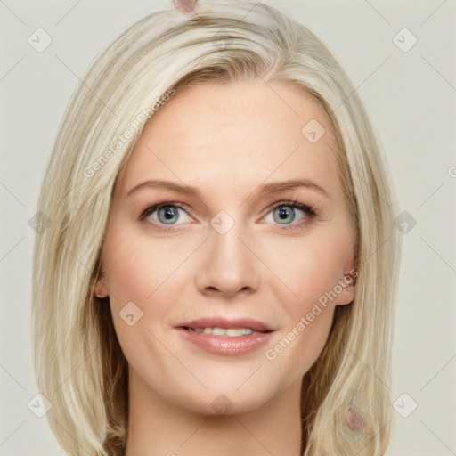 Joyful white young-adult female with long  blond hair and blue eyes