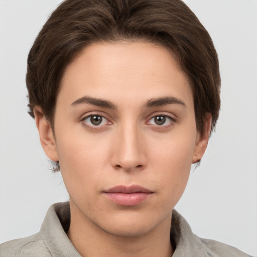 Neutral white young-adult female with short  brown hair and brown eyes