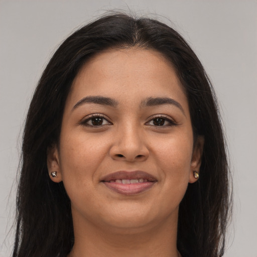 Joyful asian young-adult female with long  brown hair and brown eyes