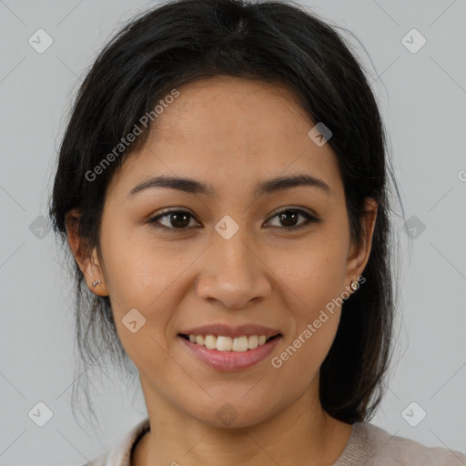 Joyful latino young-adult female with medium  brown hair and brown eyes