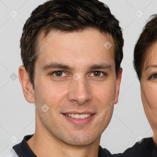 Joyful white young-adult male with short  brown hair and brown eyes