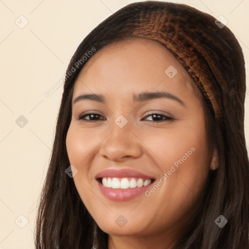 Joyful white young-adult female with long  black hair and brown eyes