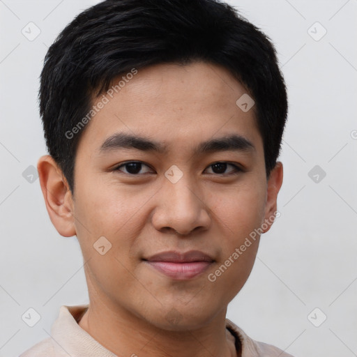 Joyful asian young-adult male with short  brown hair and brown eyes