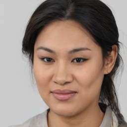 Joyful asian young-adult female with medium  brown hair and brown eyes