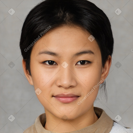 Joyful asian young-adult female with short  black hair and brown eyes