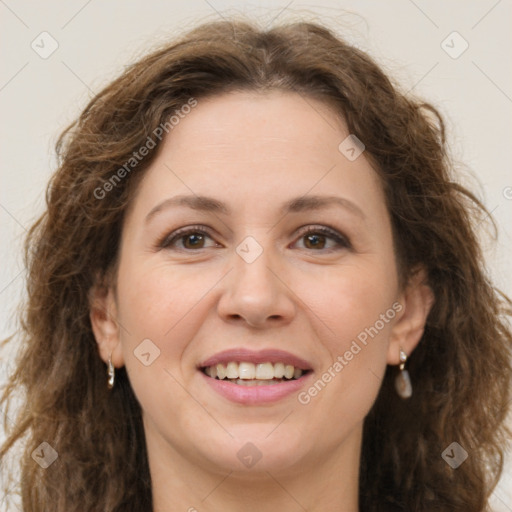 Joyful white adult female with long  brown hair and brown eyes