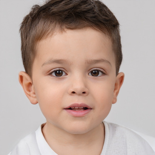 Joyful white child male with short  brown hair and brown eyes