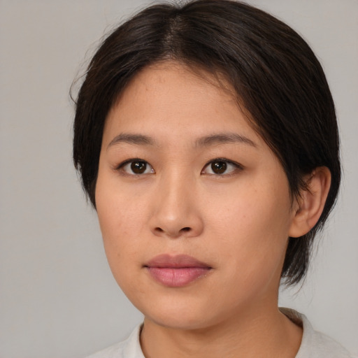 Neutral asian young-adult female with medium  brown hair and brown eyes