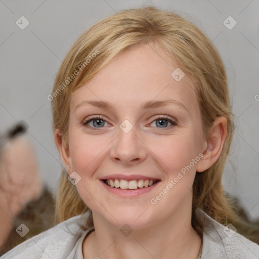 Joyful white young-adult female with medium  brown hair and blue eyes