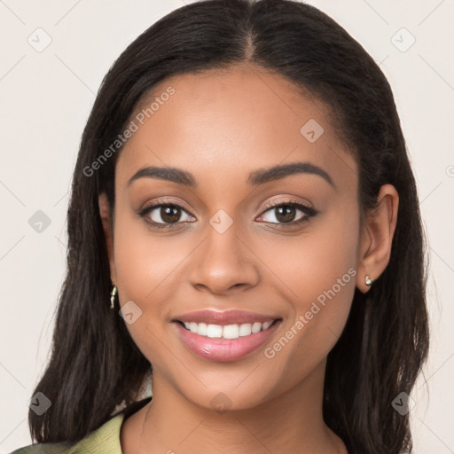 Joyful latino young-adult female with long  brown hair and brown eyes