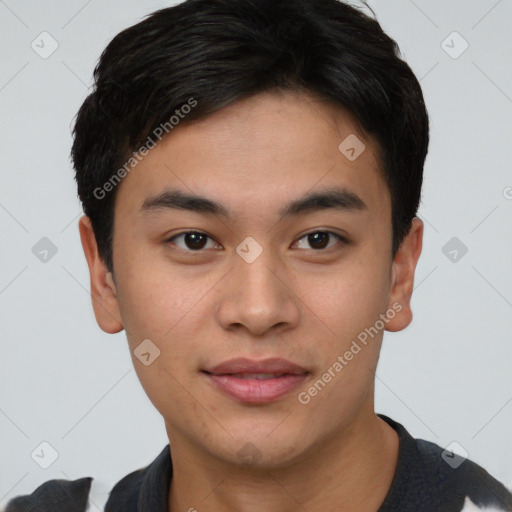 Joyful asian young-adult male with short  brown hair and brown eyes