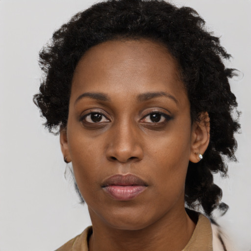 Neutral black young-adult female with long  black hair and brown eyes