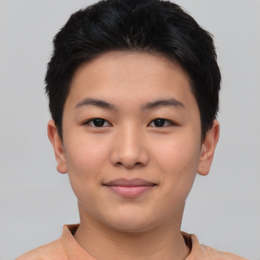 Joyful asian young-adult female with short  black hair and brown eyes