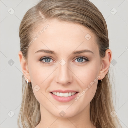 Joyful white young-adult female with long  brown hair and blue eyes