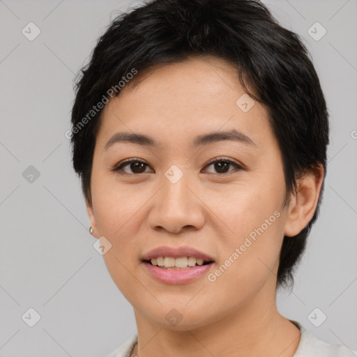 Joyful asian young-adult female with medium  black hair and brown eyes