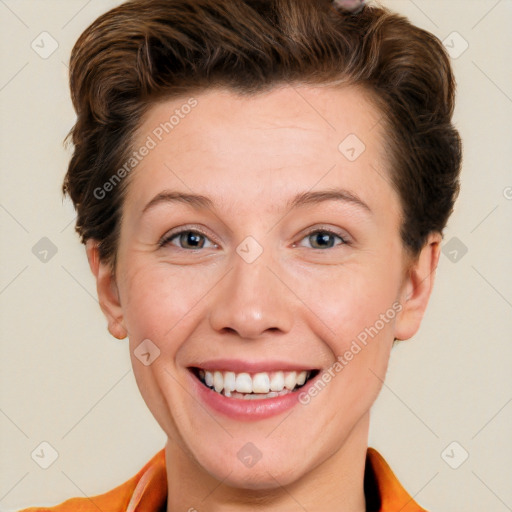 Joyful white young-adult female with short  brown hair and grey eyes