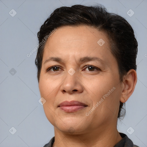 Joyful white adult female with medium  brown hair and brown eyes