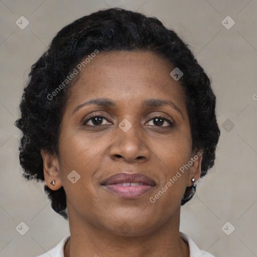 Joyful black adult female with short  brown hair and brown eyes