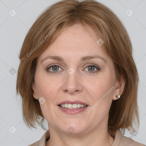 Joyful white adult female with medium  brown hair and grey eyes