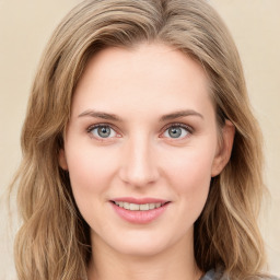 Joyful white young-adult female with medium  brown hair and green eyes