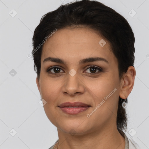 Joyful latino young-adult female with short  brown hair and brown eyes