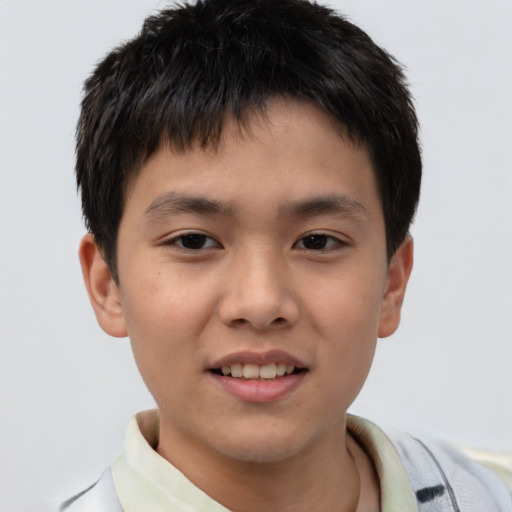 Joyful white child male with short  brown hair and brown eyes