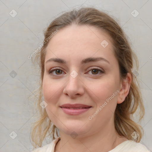 Joyful white young-adult female with medium  brown hair and blue eyes