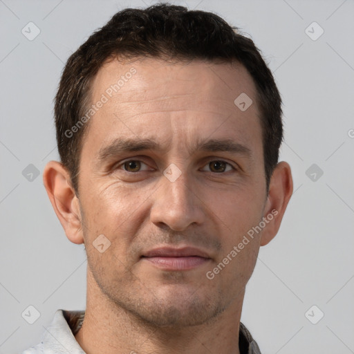 Joyful white adult male with short  brown hair and brown eyes