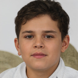 Joyful white child male with short  brown hair and brown eyes