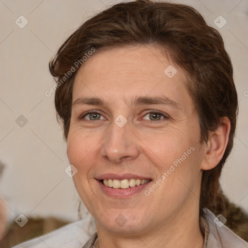 Joyful white adult female with medium  brown hair and brown eyes