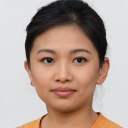 Joyful asian young-adult female with short  brown hair and brown eyes