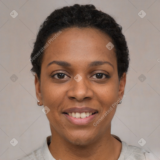 Joyful black young-adult female with short  black hair and brown eyes