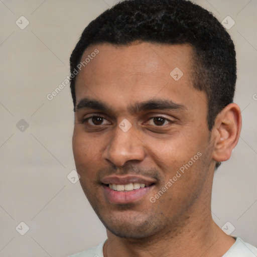 Joyful white young-adult male with short  black hair and brown eyes