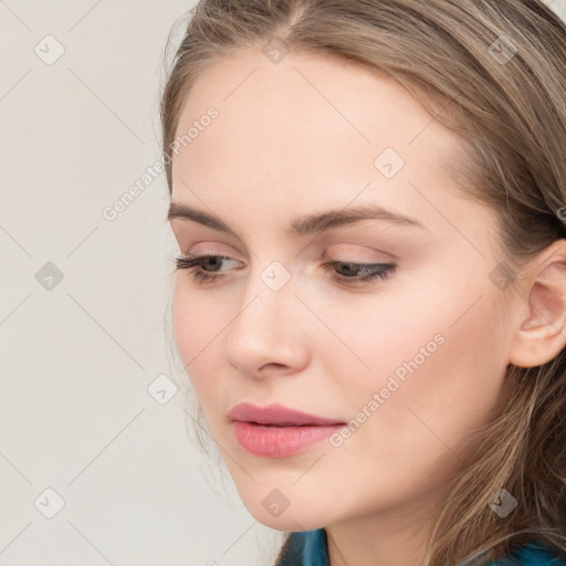 Joyful white young-adult female with long  brown hair and blue eyes