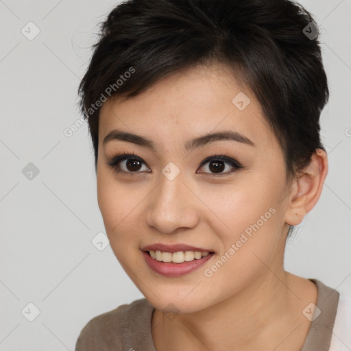 Joyful asian young-adult female with short  brown hair and brown eyes