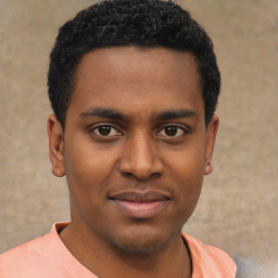 Joyful latino young-adult male with short  brown hair and brown eyes